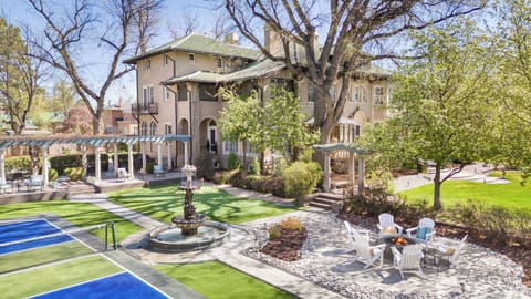 Estate Courtyard with firepit, mini golf, pickleball, hot tub, and pond