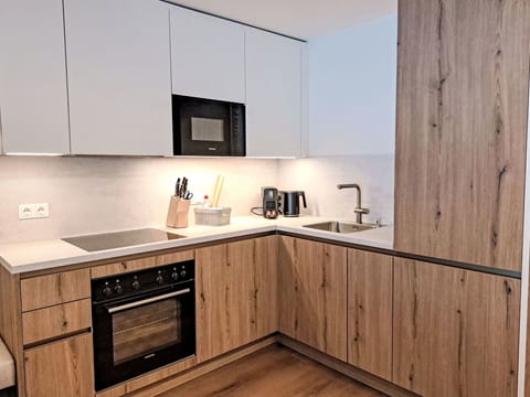 Interior Design, Wood, Flooring, Furniture, Countertop, Cabinetry, Kitchen, Floor, Wood Flooring, Kitchen Appliance