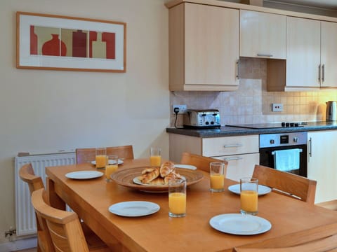 Furniture, Flooring, Interior Design, Wood, Floor, Cabinetry, Room, Major Appliance, Wood Stain, Kitchen