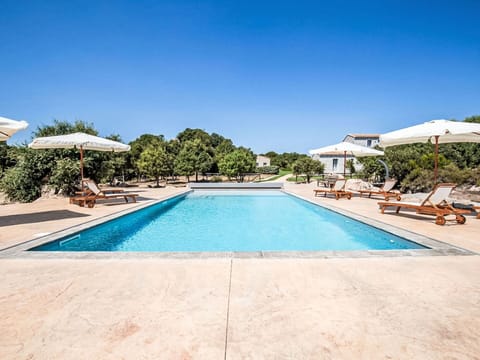 Blue, Shade, Resort, Outdoor Furniture, Leisure, Swimming Pool, Umbrella, Estate, Landscaping, Eco Hotel