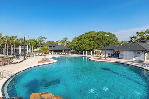 Unwind to soothing water sounds at the pool’s edge.