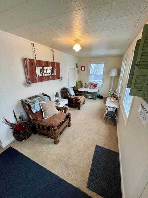 Sunroom.
Games under corner bench.