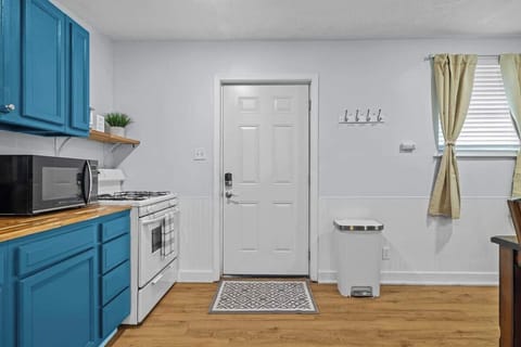 Welcoming entryway leading into the bright kitchen and dining area.