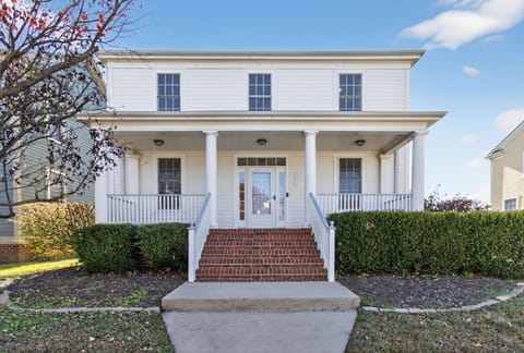 Welcome! This charming two-story home greets you with classic Southern charm and a picture-perfect porch. The bright, clean curb appeal sets the tone for a relaxing stay. 