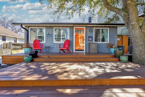 A charming front porch with outdoor seating invites you to relax and enjoy the fresh air. The warm exterior design makes you feel instantly at home.