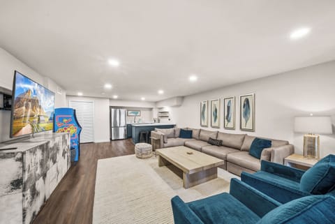 Lower Level Family Room with Arcade and Half-Kitchen