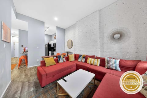 This cozy living room features a plush couch and a vibrant red sectional, perfect for lounging after a day of adventure. Gather around the coffee table for game night or unwind with your favorite book.