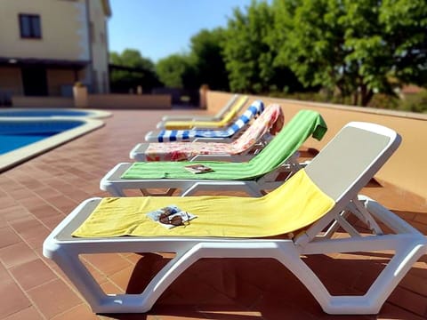 Swimming Pool, Outdoor Furniture, Furniture, Flooring, Resort, Floor, Composite Material, Shade, Chair, Water Feature
