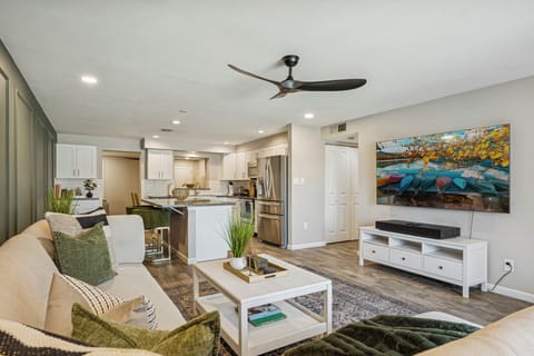 Large flat screen smart tv in our wide open living room area.
