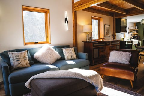 Cozy livingroom in an open concept second level with deck