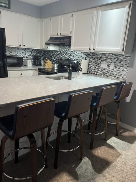 New leather, swivel barstools with lumbar support.