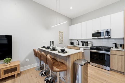 Bright kitchen island set up for quick breakfasts or lingering coffee moments