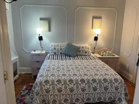 Queen-sized bed with closet and window