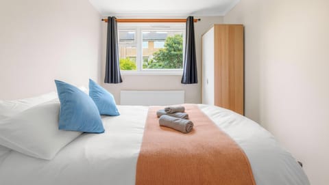 Comfortable double bed with fresh linen and towels provided.