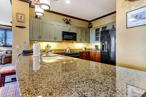 Warm kitchen w/ ample counter space for cooking together.