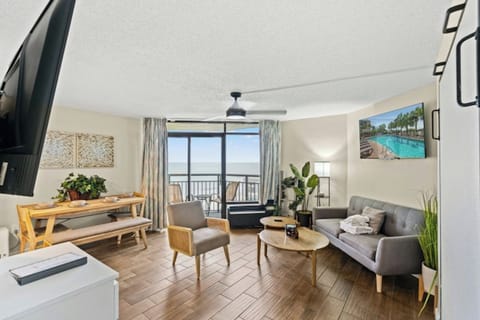 Let in the sunrays as you relax in the comfort of this living room with a view.