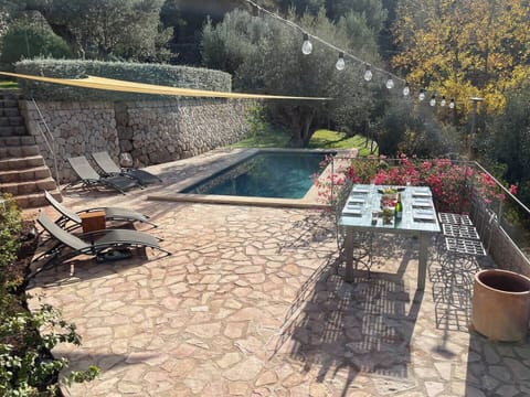 Private pool with large terraced area, sun loungers and casual eating