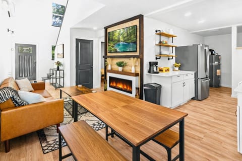 Cozy living room with fireplace and TV, perfect after a day at Mt. Rainier