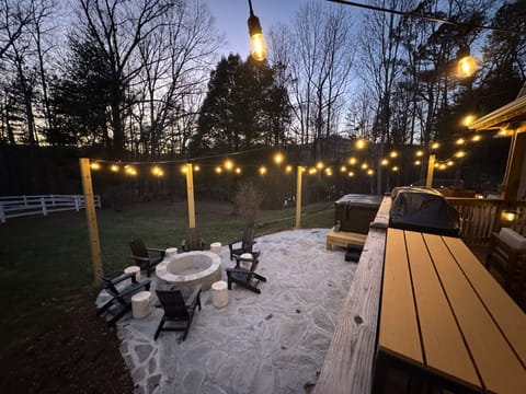 Evenings come alive around the glowing fire pit and hot tub — your private backyard escape for s’mores, stargazing, and unforgettable nights under the string lights.