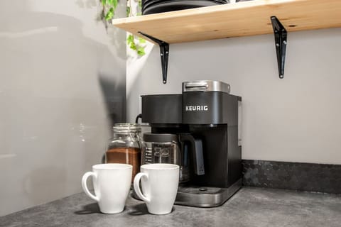 Premium Keurig coffee station with dual drip coffee and k-cup coffee makers. Complimentary coffee supplies to start your mornings right.