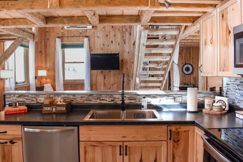 Open concept kitchen and living room create a welcoming space for everyone.