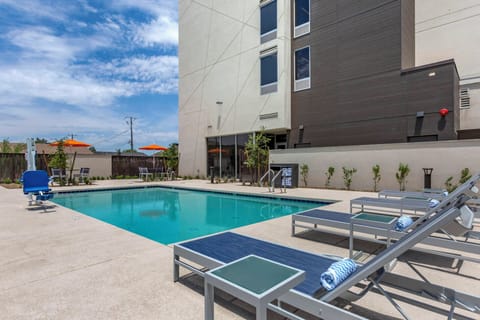 Soak up the sun beside the sparkling pool and loungers.