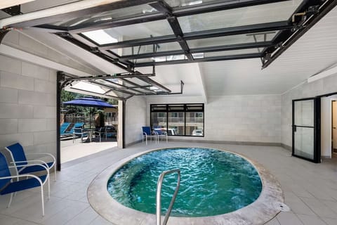 Soak in bubbling warmth in the bright indoor hot tub.