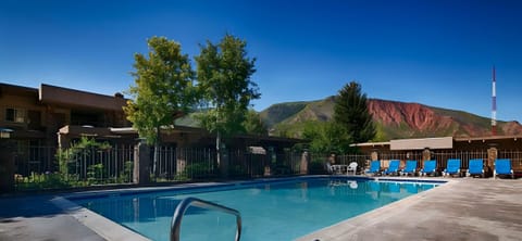 Cool off in the sparkling pool under clear blue skies.
