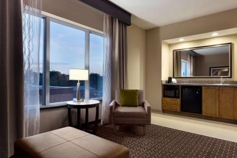 Stretch out in a spacious suite with lounge seating.