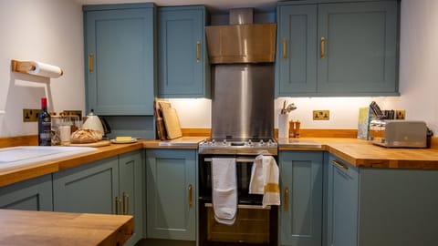 The kitchen has a traditional design with a contemporary twist.