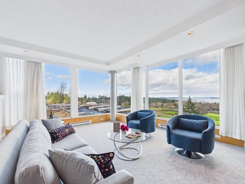 Modern coastal lounge featuring panoramic Haro Strait views.