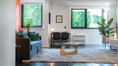 Open-plan living area adjacent to the dining table.