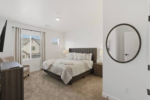 King bedroom with private en-suite bathroom and TV.