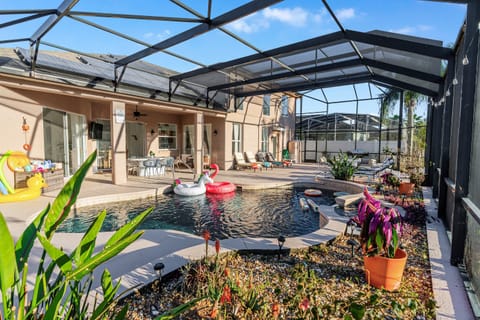 Private west-facing, sky-high lanai pool deck with ample seating. Perfect for sunsets, lounging, and outdoor dining. Grill ready for poolside meals and evening cookouts