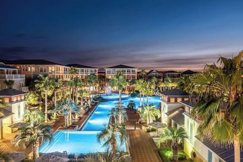 Resort style community pool with pool side cafe, cabanas, lounge chairs