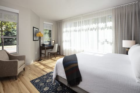 Stretch out in a bright, airy room with leafy views.