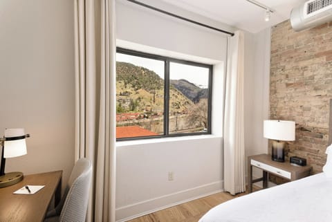 Catch morning light while journaling at the quiet in-room desk.