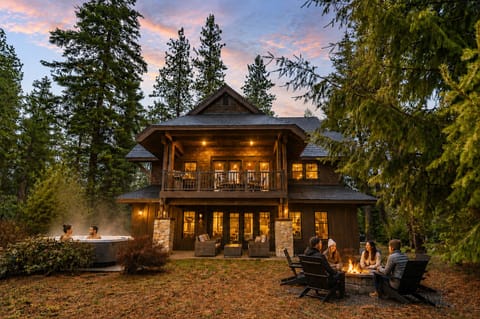 Twilight ambiance and guests shown in this photo were digitally enhanced using AI to help showcase the outdoor experience and amenities. The home, golf course views, fire pit, deck, and all amenities are real and accurately represented.