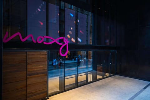 Nighttime exterior signage with graphic light display