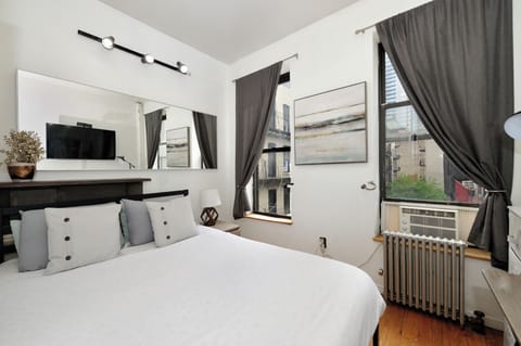 Your stylish bedroom features crisp white linens, modern lighting, and a smart TV for cozy evenings in.