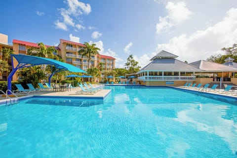 Dive into sparkling turquoise water and stretch out poolside.