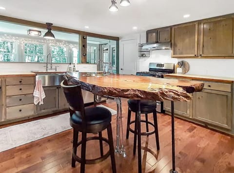 Spacious kitchen filled with a range of kitchen gadgets.