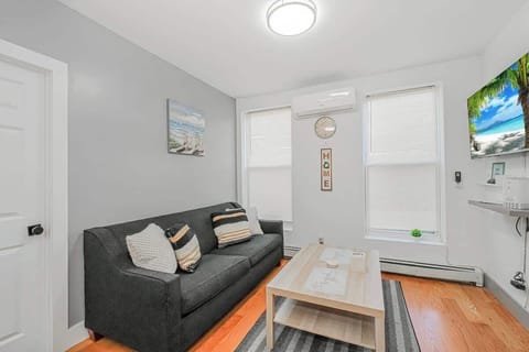 Comfort & Style: Inviting lounge area with a sofa, coffee table, and  plenty of natural light.