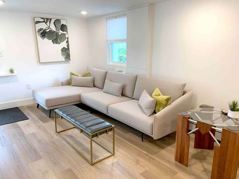 The living room has a smart TV and is open to the rest of the space. Car parking is directly outside the door for easy access!