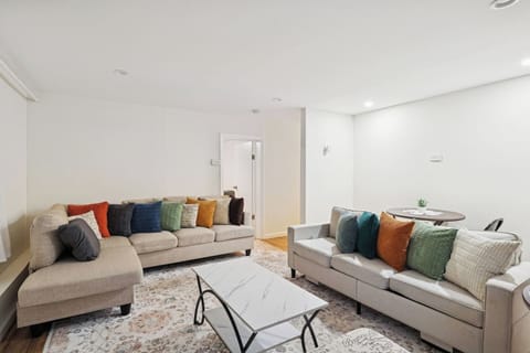 Bright, comfortable living room with Smart TV, workspace, and seating for the whole family — perfect for long stays, work trips, and relaxation