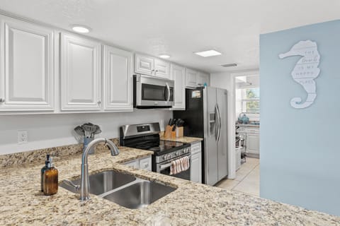 Functional kitchen layout with ample counter space.