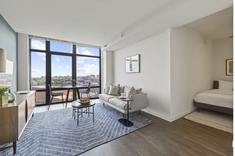 Unwind by floor-to-ceiling windows with sweeping city views.