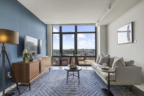 Unwind on the sofa and watch sunsets through tall windows.