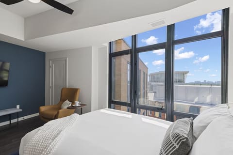 Linger in bed and enjoy bright, open city vistas.