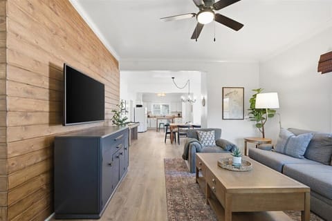 Bright open living room flowing into the kitchen—perfect for relaxing